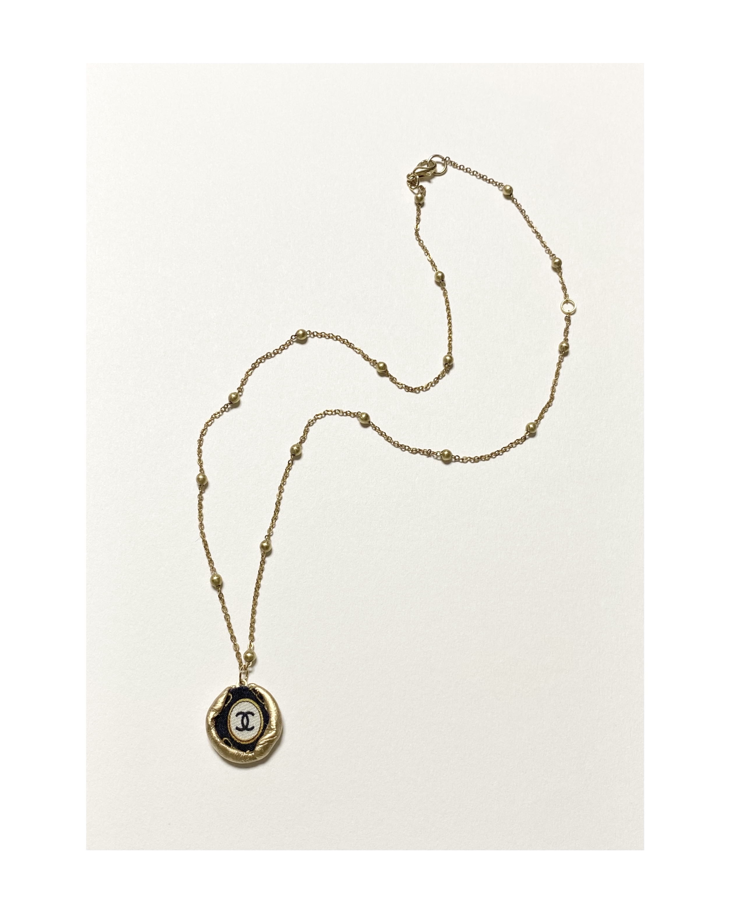 CHANEL gold silk CC necklace no.11