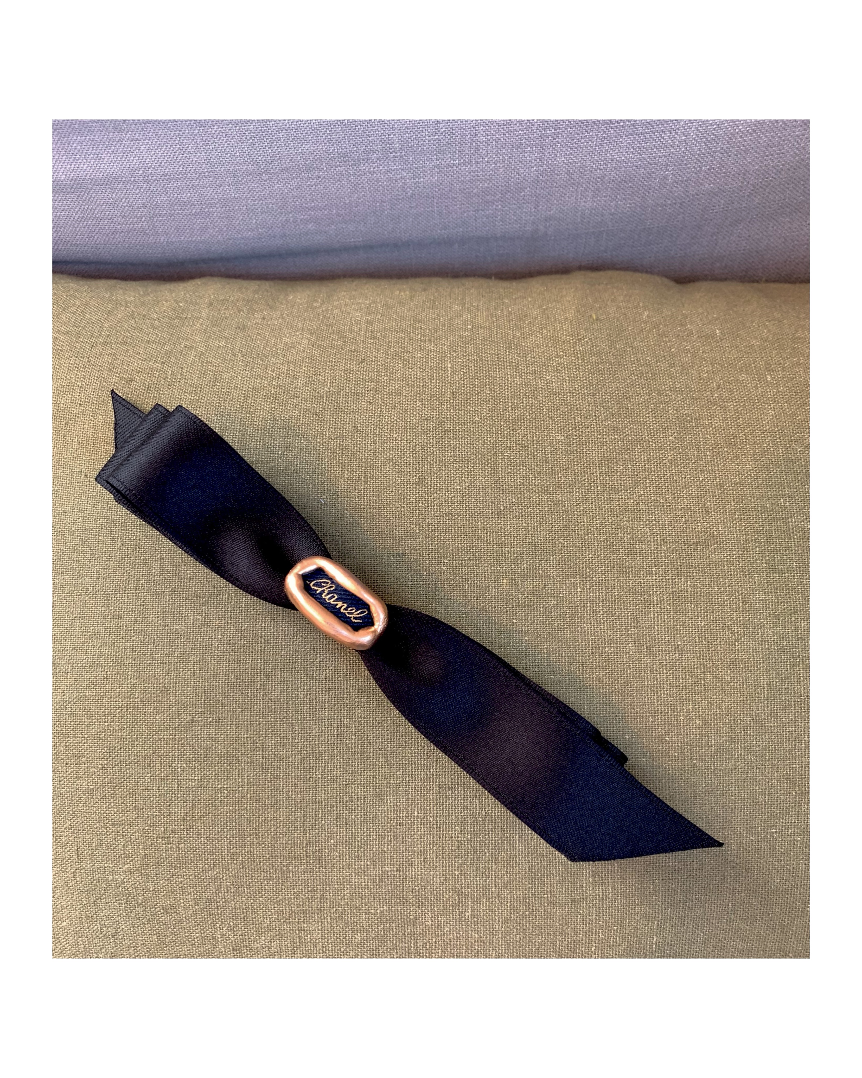 CHANEL navy Initial ribbon hairclip no.49