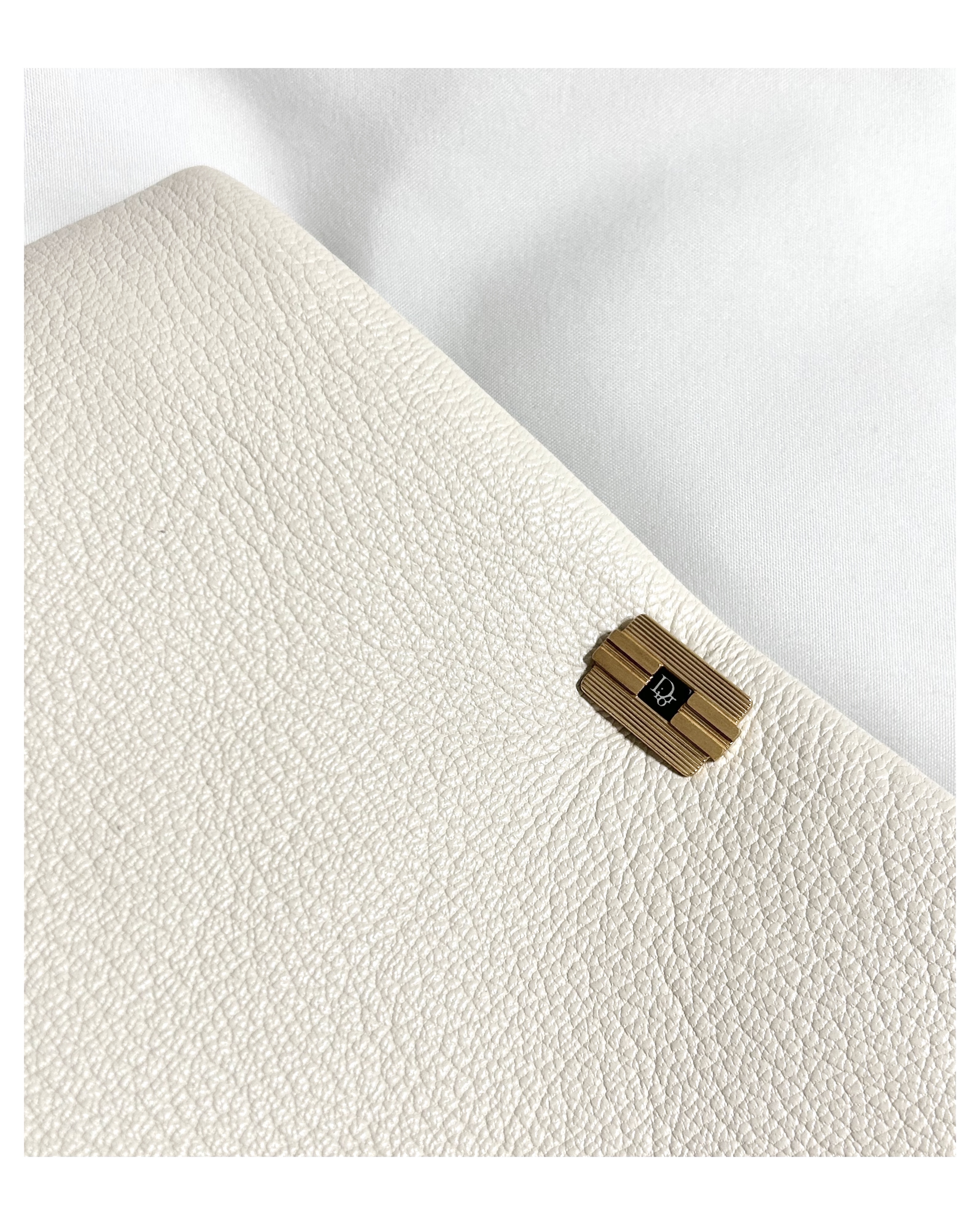 Dior cuff link clutch bag