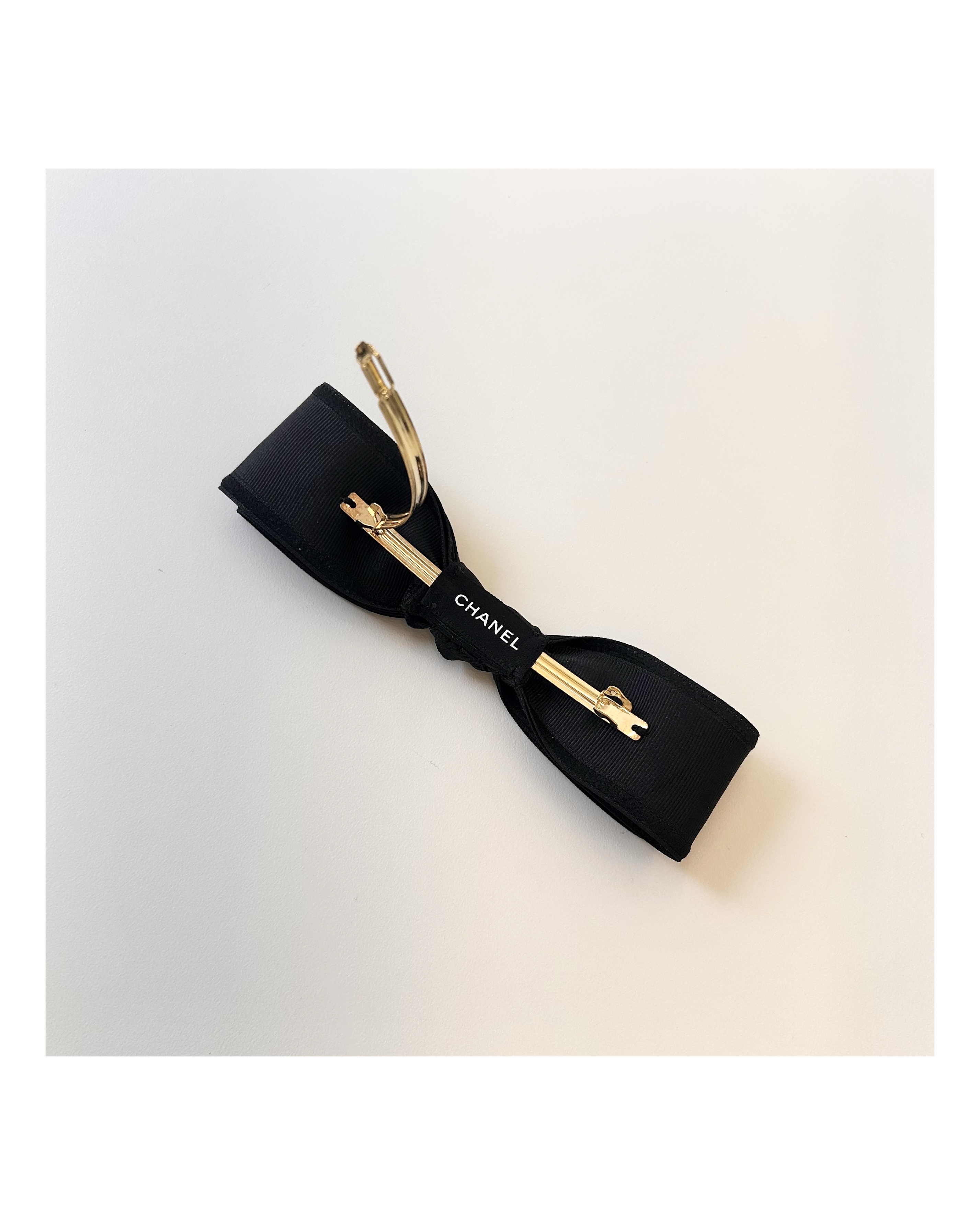 CHANEL initial black ribbon hair clip no.66