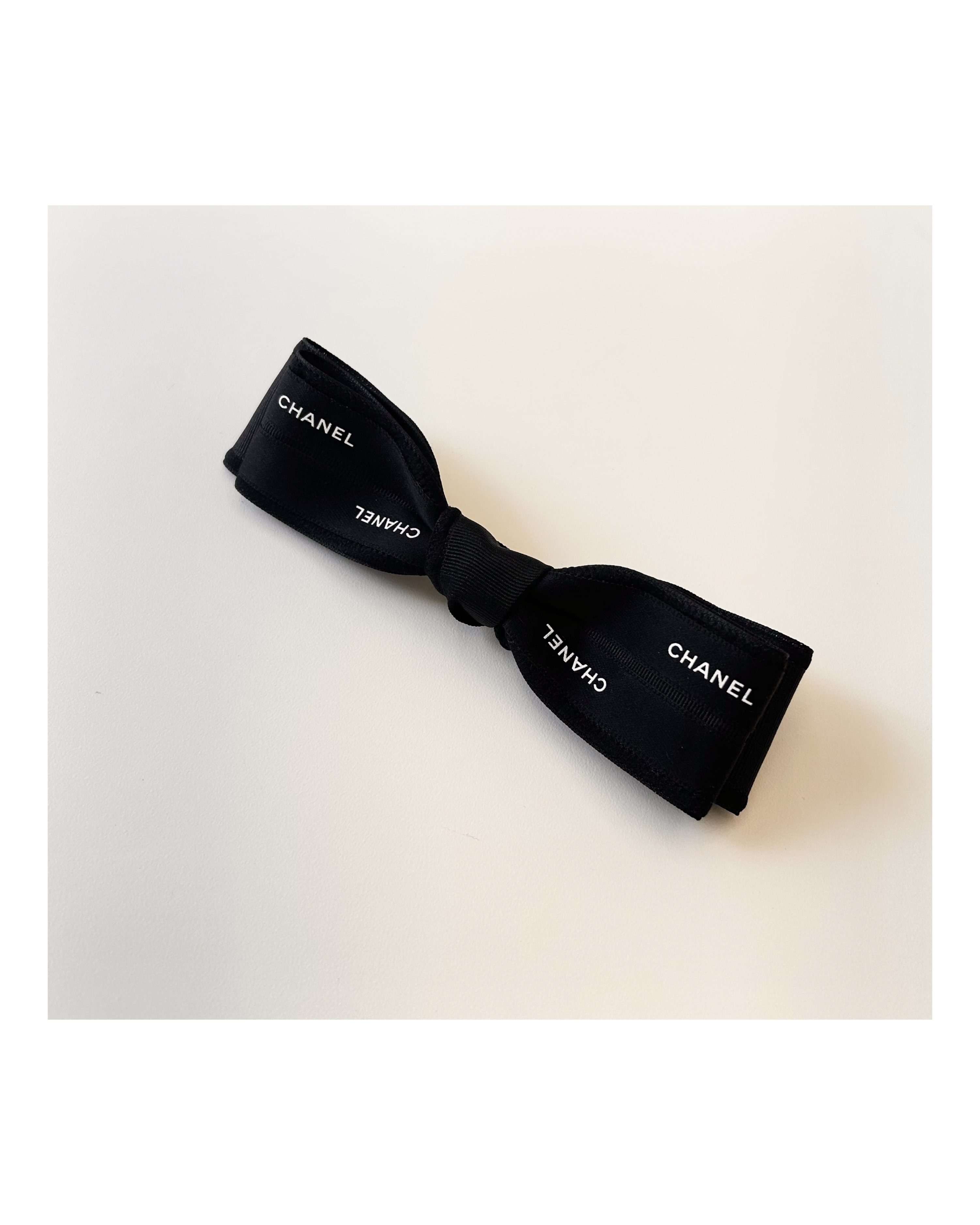 CHANEL initial black ribbon hair clip no.66