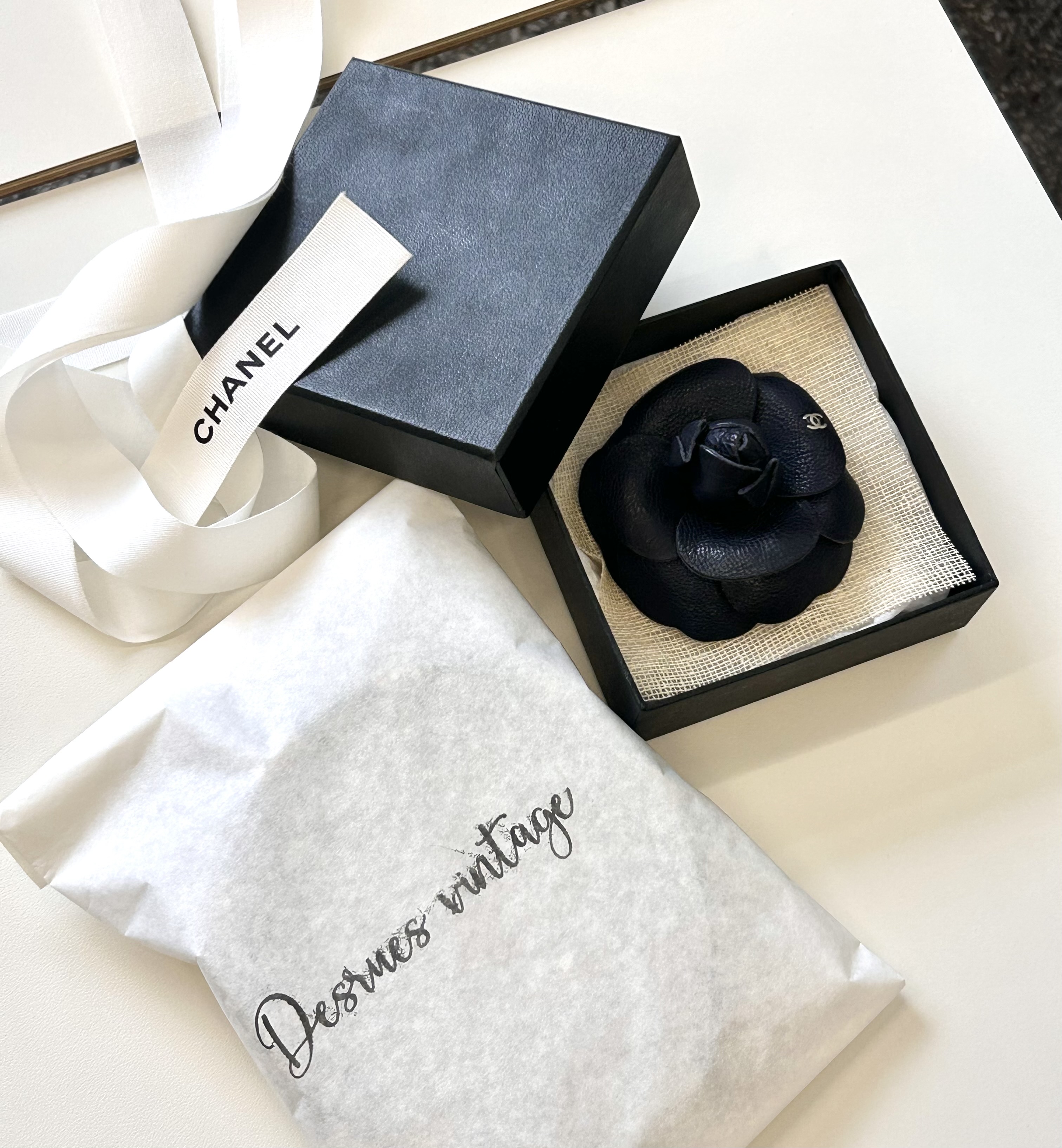 CHANEL dark navy leather Camellia brooch