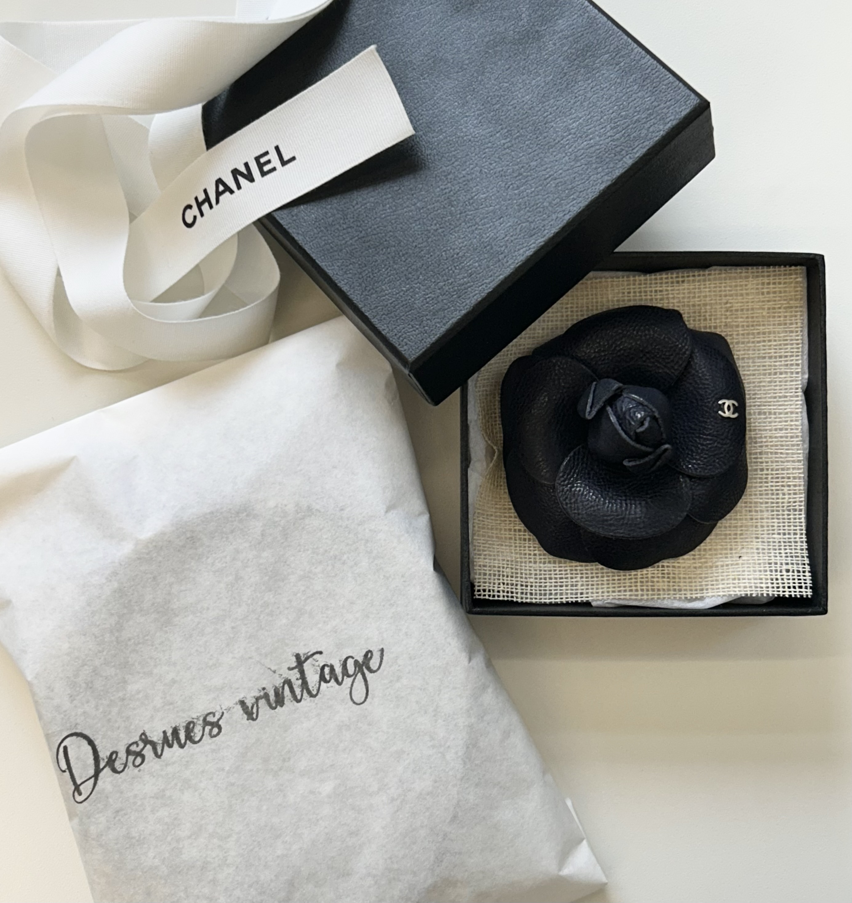 CHANEL dark navy leather Camellia brooch