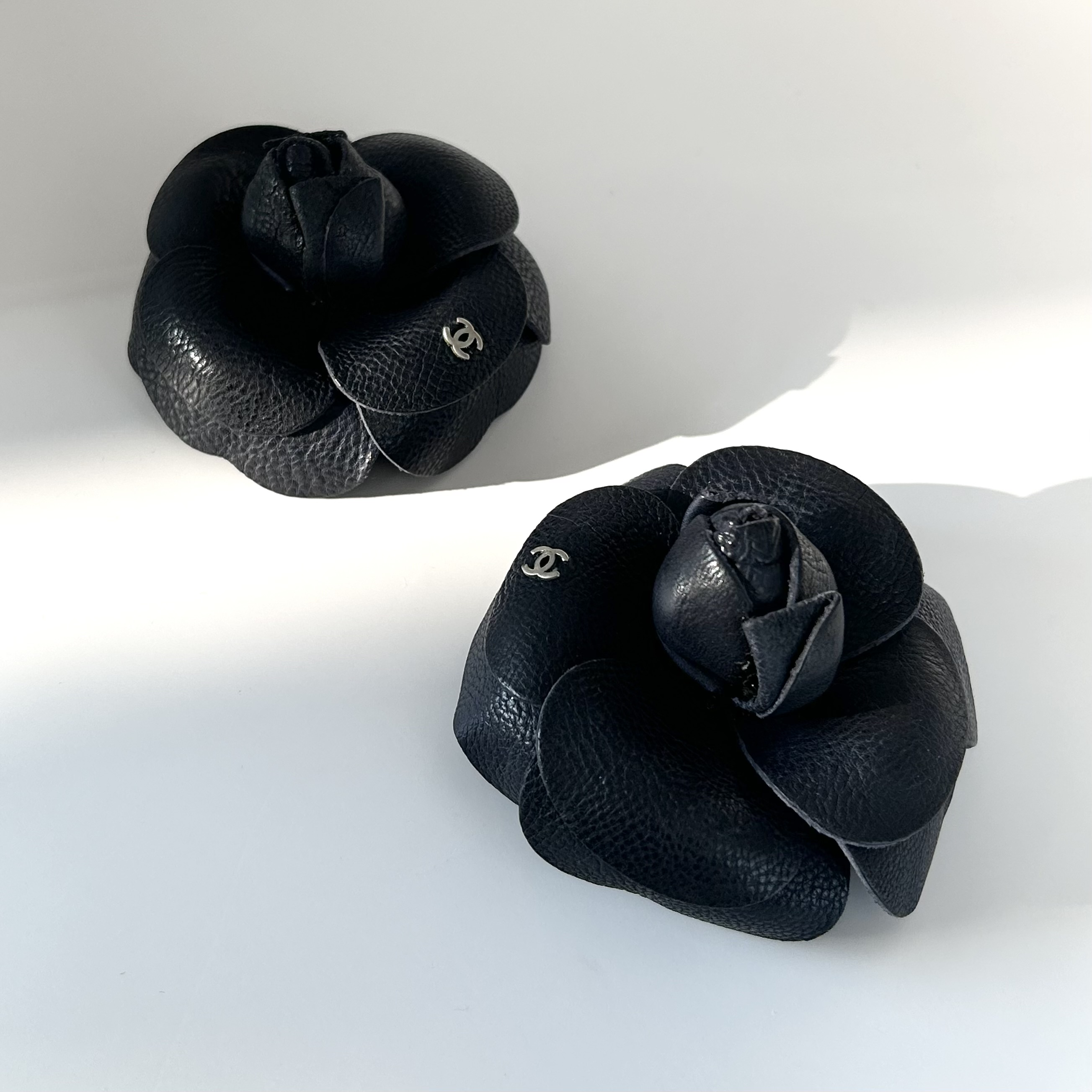CHANEL dark navy leather Camellia brooch