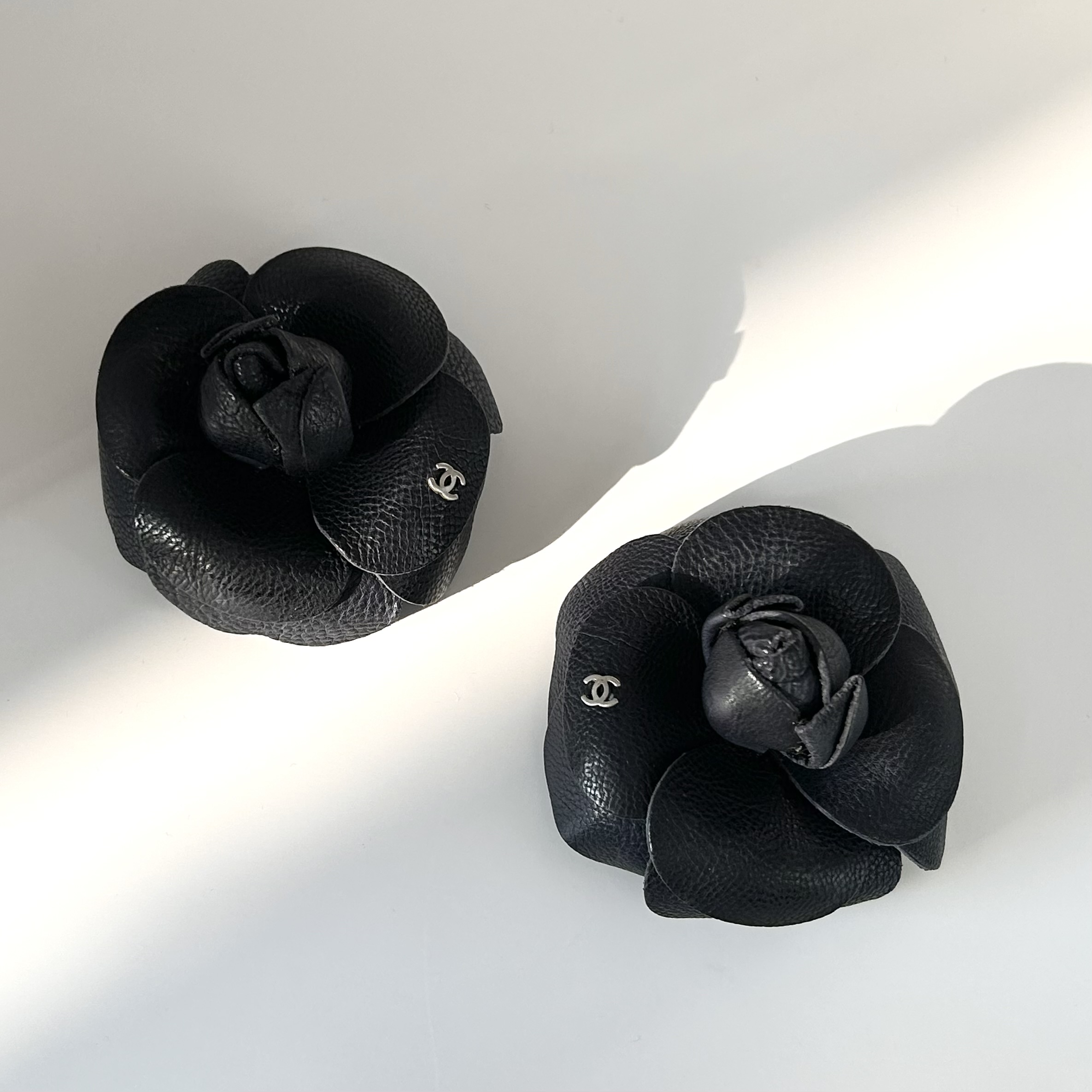 CHANEL dark navy leather Camellia brooch