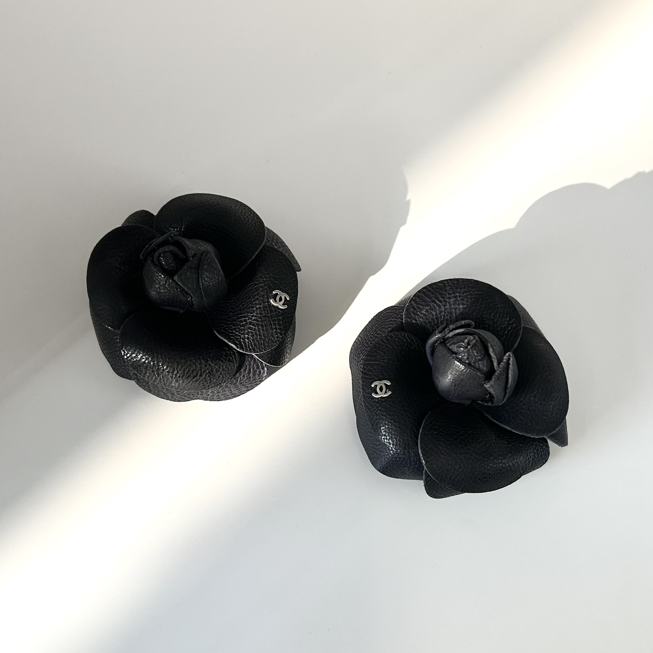 CHANEL dark navy leather Camellia brooch