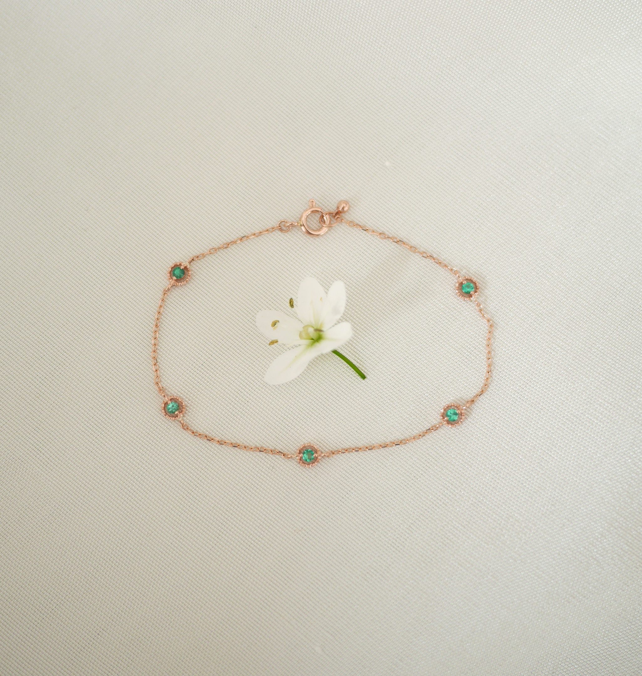 emerald comma bracelet