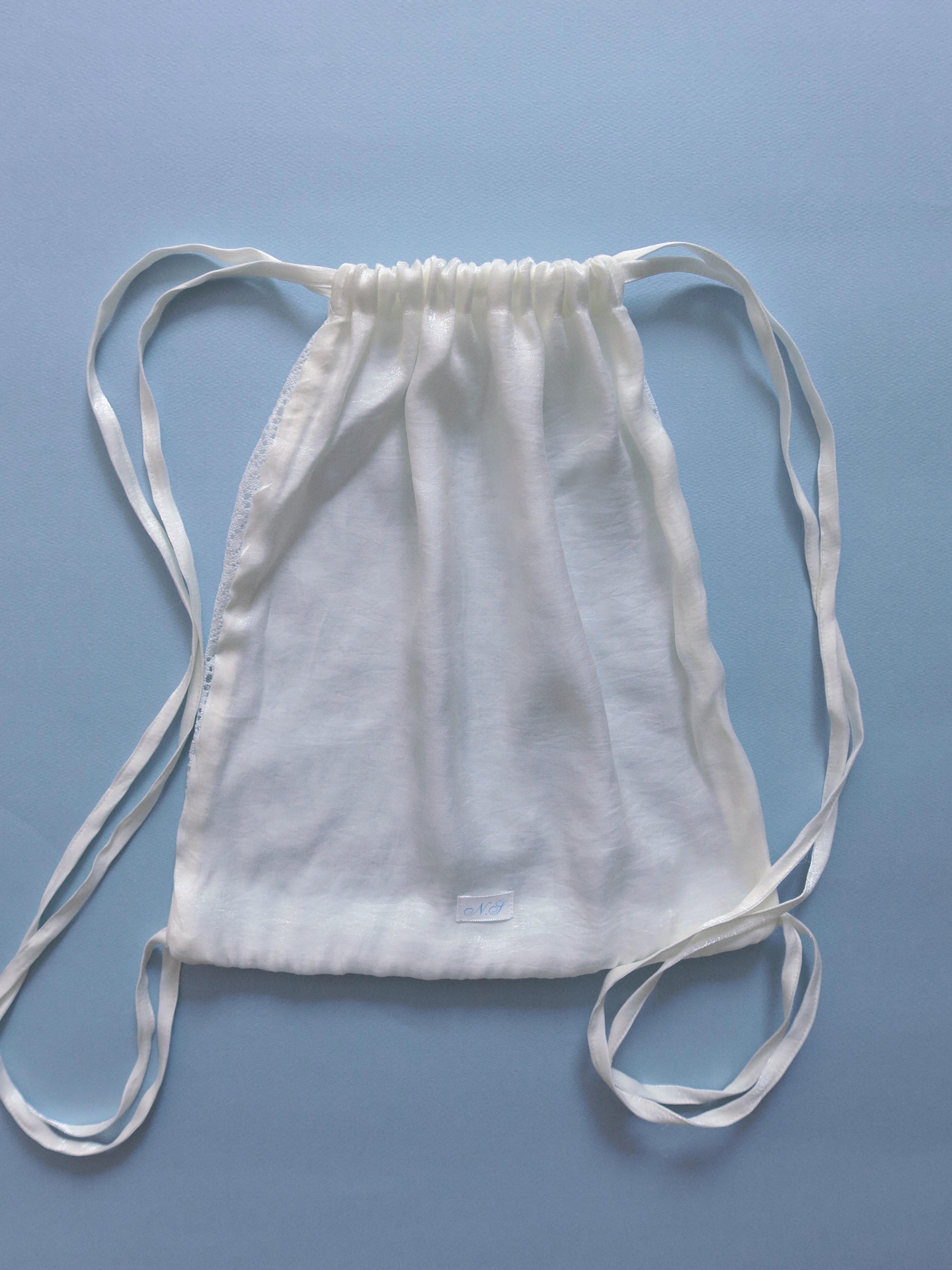 Paisley lace string bag